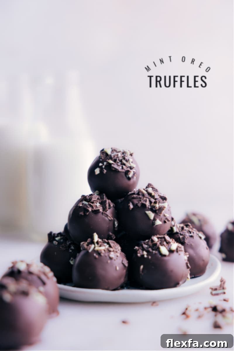 Image of the Mint Oreo Truffles stacked on top of each other, showcasing their perfect round shape and chocolate coating.