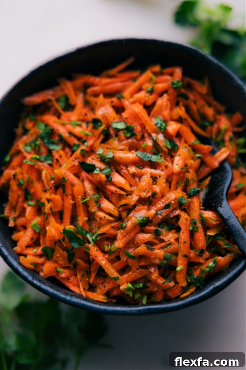 Up-close overhead image of the French Carrot Salad dish ready to be enjoyed, showcasing its vibrant colors and fresh texture