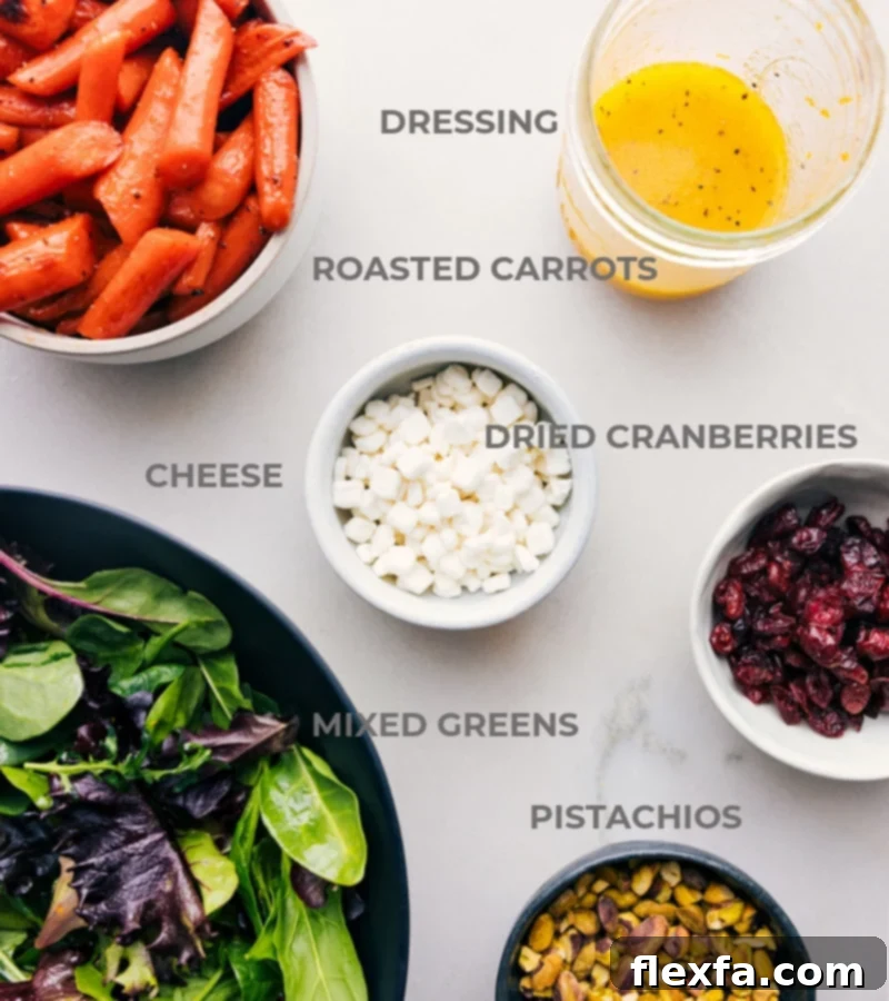 Fresh Ingredients for Roasted Carrot Salad A flat lay of all the fresh, high-quality ingredients prepped and laid out on a white surface, ready for easy assembly of the roasted carrot salad.