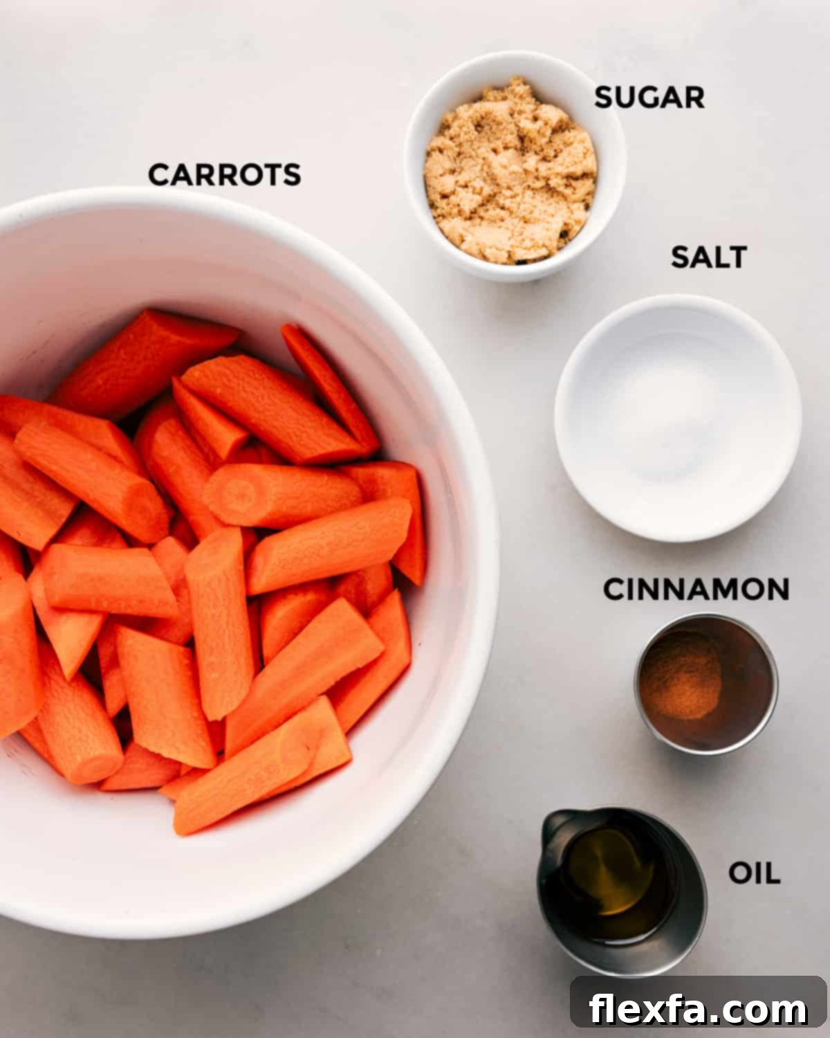 All the essential ingredients for brown sugar roasted carrots, including fresh carrots, a bowl of brown sugar, olive oil, cinnamon, and salt, meticulously prepped and ready for assembly.