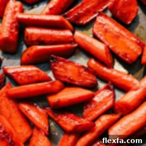 A beautifully plated serving of golden-brown brown sugar roasted carrots, garnished lightly, showcasing their tender texture and inviting glaze.