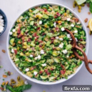Herbalicious Quinoa Salad ready to be served, a perfect blend of fresh and vibrant ingredients.