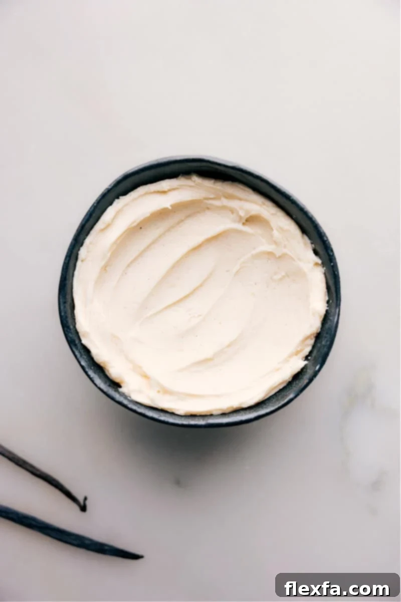 An inviting overhead view of a bowl filled with freshly made, smooth Vanilla Frosting, showcasing its perfect creamy texture.