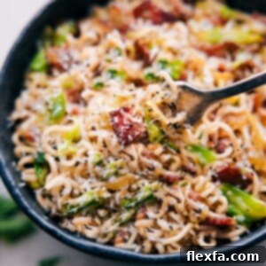 A close-up image of the Fried Cabbage Ramen dish, featuring crispy bacon, tender cabbage, and noodles