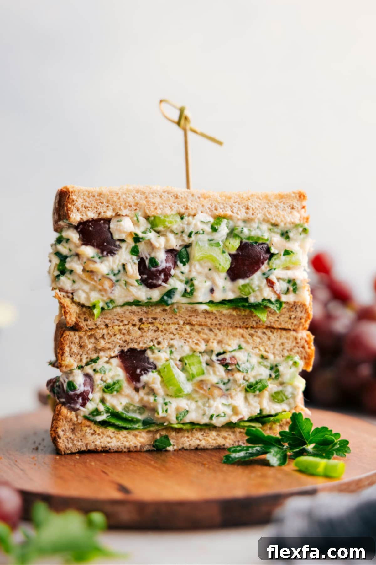 Delicious and healthy chicken salad recipe layered into some whole-grain bread for a perfect sandwich. A wholesome and satisfying meal.