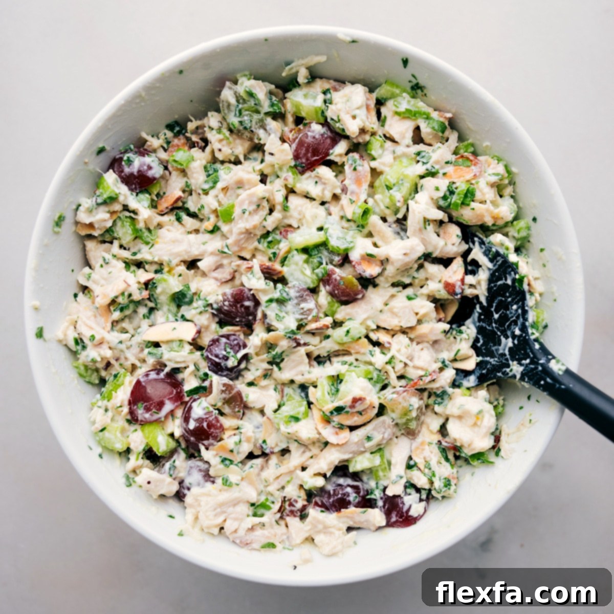 Healthy Chicken Salad Recipe in a large bowl, garnished with fresh herbs, ready to be enjoyed as a refreshing and satisfying meal.