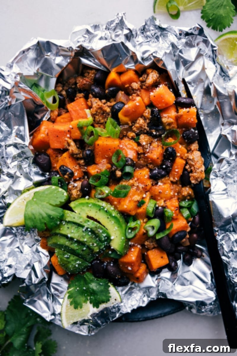 Taco Sweet Potato Foil Packets, fresh and steaming, ready to be served from the grill.