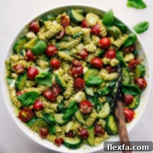 Delicious Pesto Pasta Salad presented in a serving bowl, showcasing its inviting texture, vibrant colors, and fresh ingredients.