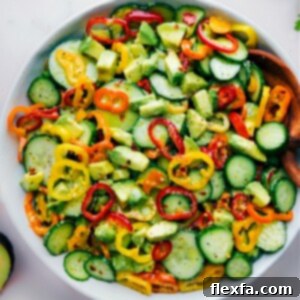A bowl of fresh Cucumber Pepper Salad with vibrant colors.