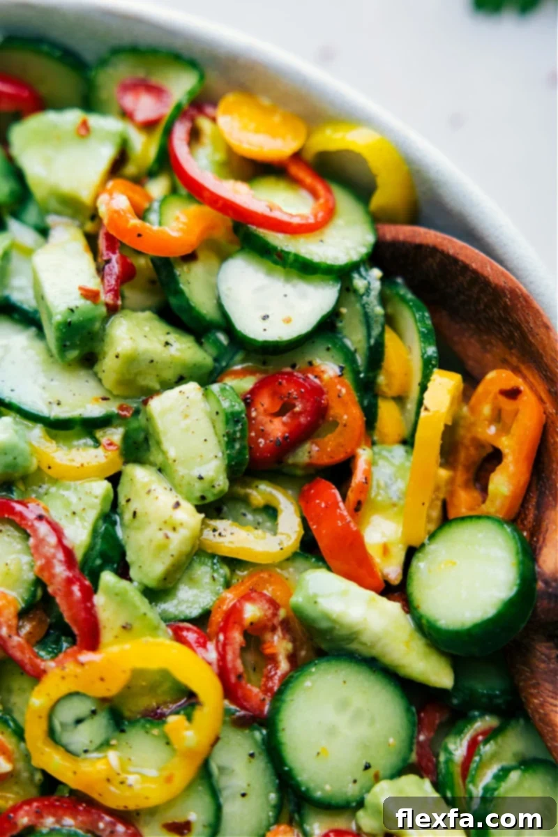 Beautifully presented Cucumber Pepper Salad, perfectly dressed and ready to be enjoyed, suggesting it's the ideal salad for summer gatherings.