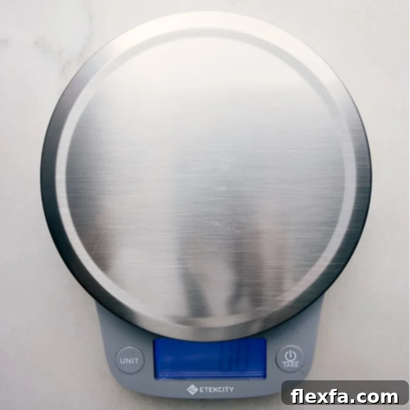 A modern digital food scale displaying a precise measurement, emphasizing accuracy in baking and cooking.