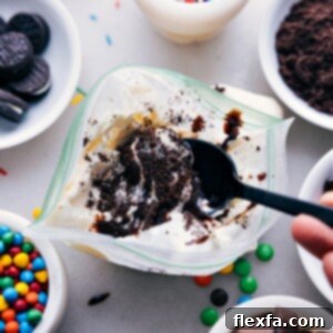 Scoop of creamy vanilla ice cream in a bowl, with sprinkles on top.