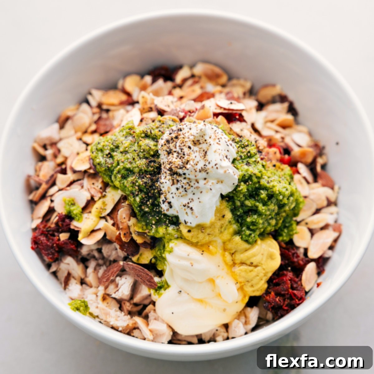 All the ingredients added to a large bowl about to be stirred, showing the vibrant colors.
