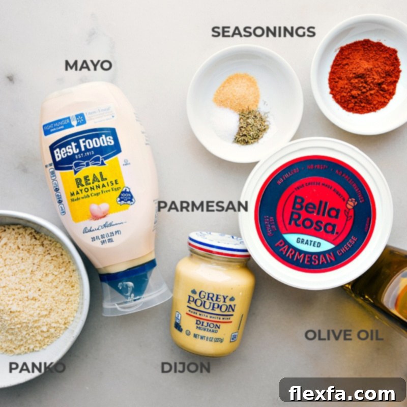 A curated overhead shot displaying all the fresh and simple ingredients required for the Baked Cod recipe, including cod fillets, Dijon mustard, mayonnaise, paprika, panko breadcrumbs, Parmesan cheese, olive oil, and lemon.