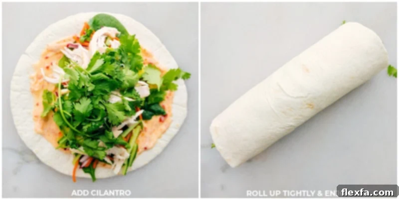A Thai Chicken Wrap being tightly rolled, showing the vibrant fillings perfectly encased in the tortilla.