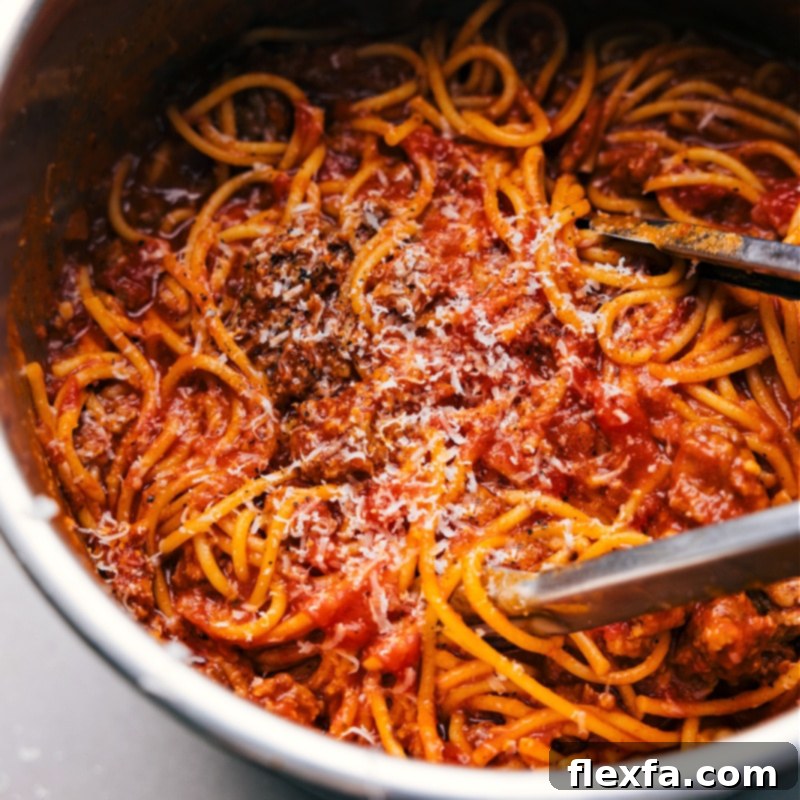 Close-up overhead view of the Instant Pot Spaghetti, creamy and rich, ready to be served directly from the pot.
