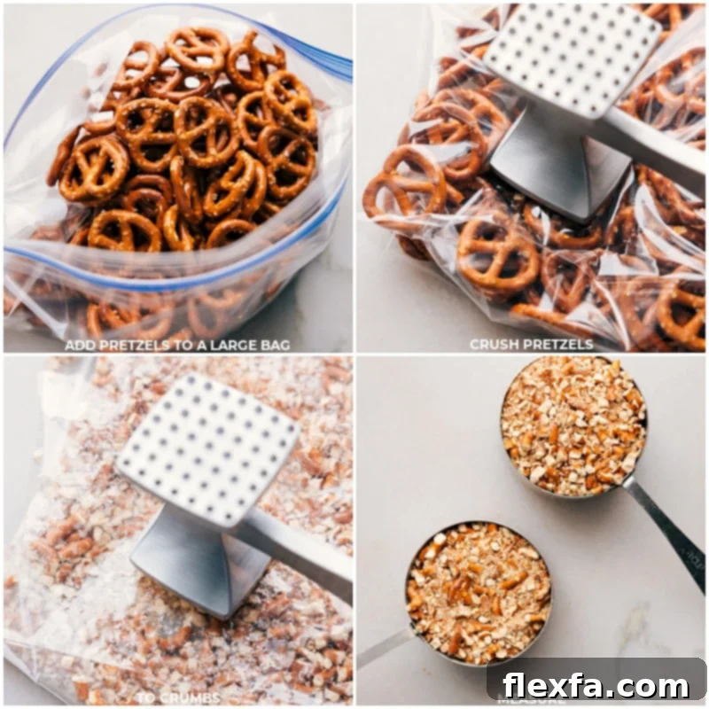 Close-up of pretzels being crushed in a plastic bag with a rolling pin for the crust of Peanut Butter Pretzel Bars.