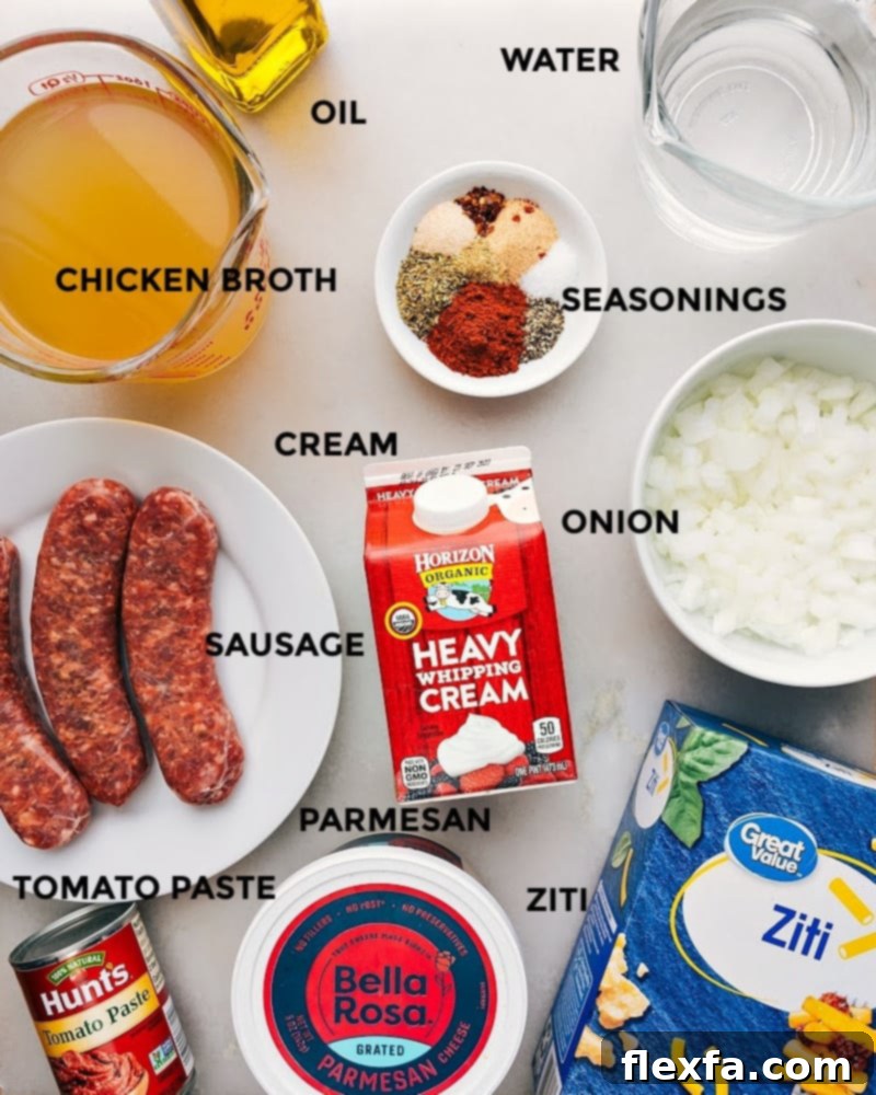 A flat lay image showcasing all fresh ingredients laid out for Instant Pot Baked Ziti: ground Italian sausage, ziti pasta, tomato paste, heavy cream, chicken broth, water, onion, Parmesan cheese, and various seasonings.