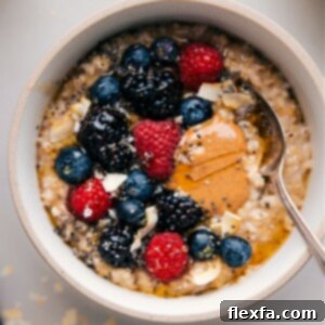 A close-up of creamy Instant Pot Oatmeal in a bowl, with a spoon ready to scoop, highlighting its perfect texture.