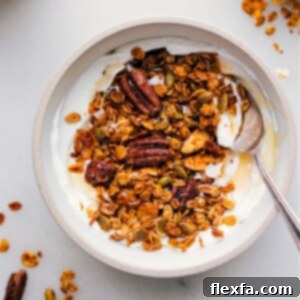 Finished Pumpkin Granola in a bowl, showing its golden clusters and wholesome ingredients.