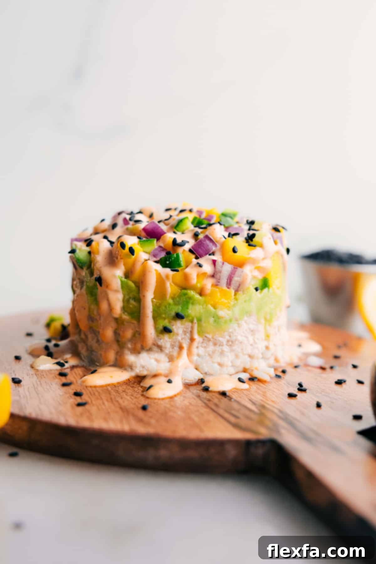 Enjoy this Tuna Stack drizzled with creamy sriracha mayo.