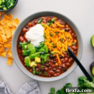 A bowl of Taco Soup with various toppings adds a burst of flavor and texture to this delicious dish.