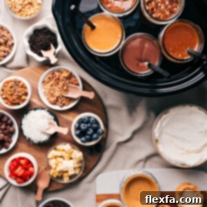 A variety of dessert toppings and fillings, including glass jars filled with caramel, chocolate, and other sauces, accompanied by bowls of crushed nuts, blueberries, coconut shreds, chocolate chips, and other delectable ingredients for a dessert pie bar.