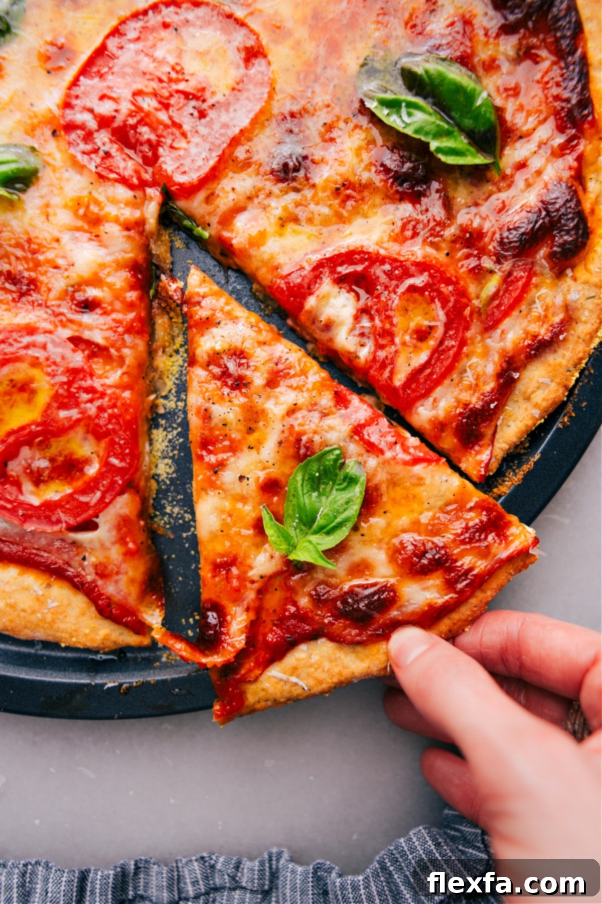 Freshly baked No-Yeast Pizza with a slice being lifted out, showing the golden, crispy crust and melted cheese.