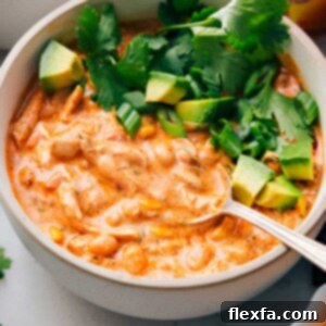 A big bowl of Buffalo Chicken Chili with a spoon in it.
