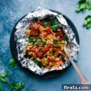 Prepared Tin Foil Jambalaya in a bowl, garnished with fresh parsley