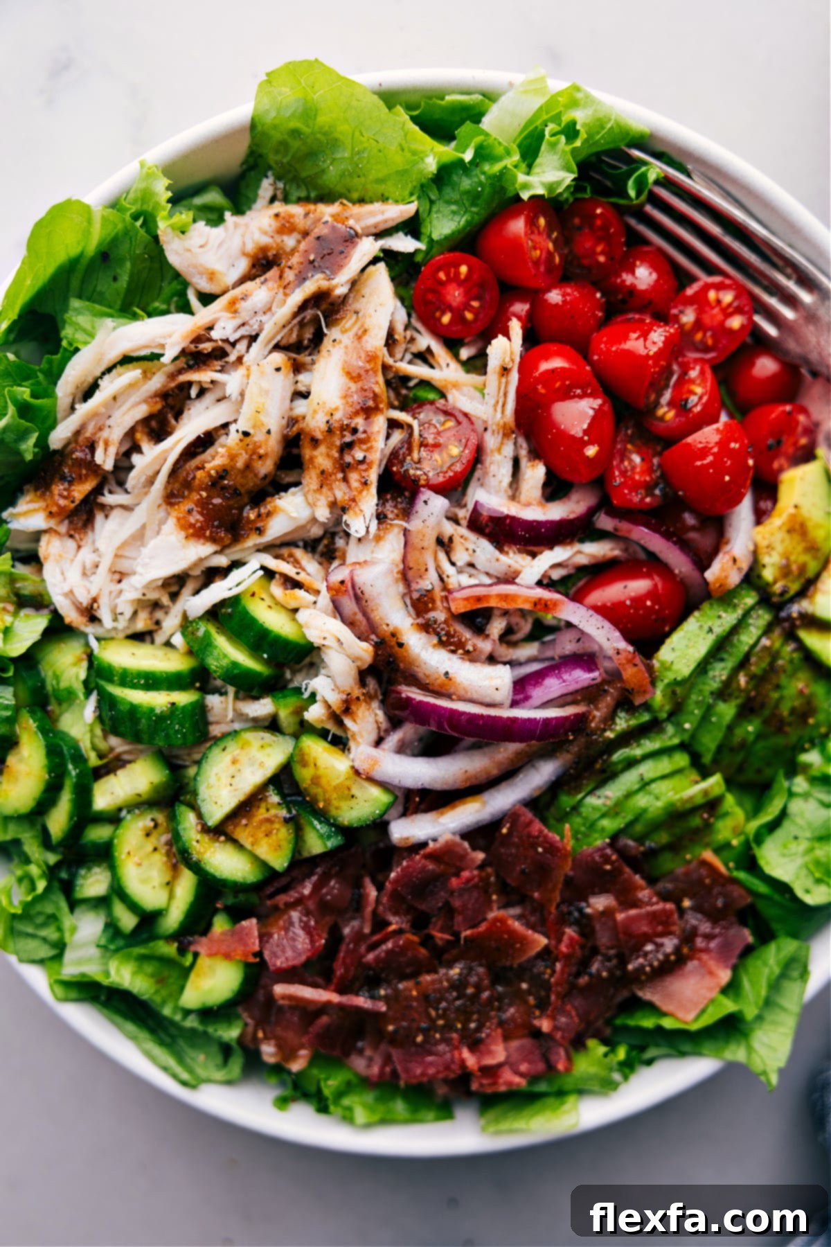 The Best Turkey Bacon Avocado Salad A big, inviting bowl of Turkey Bacon Avocado Salad, beautifully plated and ready to be served, showcasing the rich colors and textures of the ingredients.