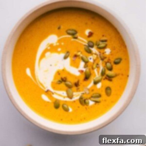 A bowl of pumpkin curry soup ready to be enjoyed.