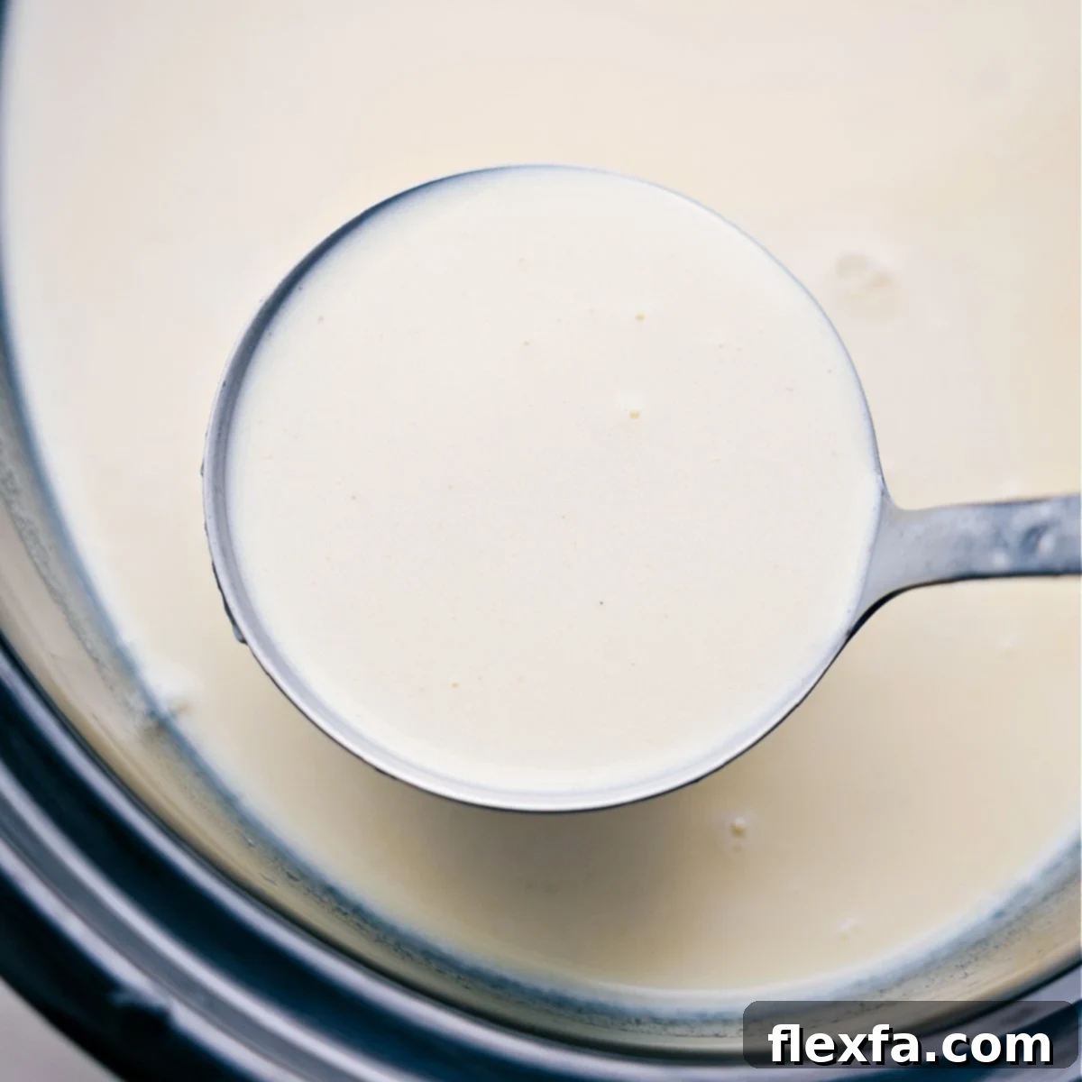 A ladle full of the warm and freshly prepared beverage, ready to be served and enjoyed.