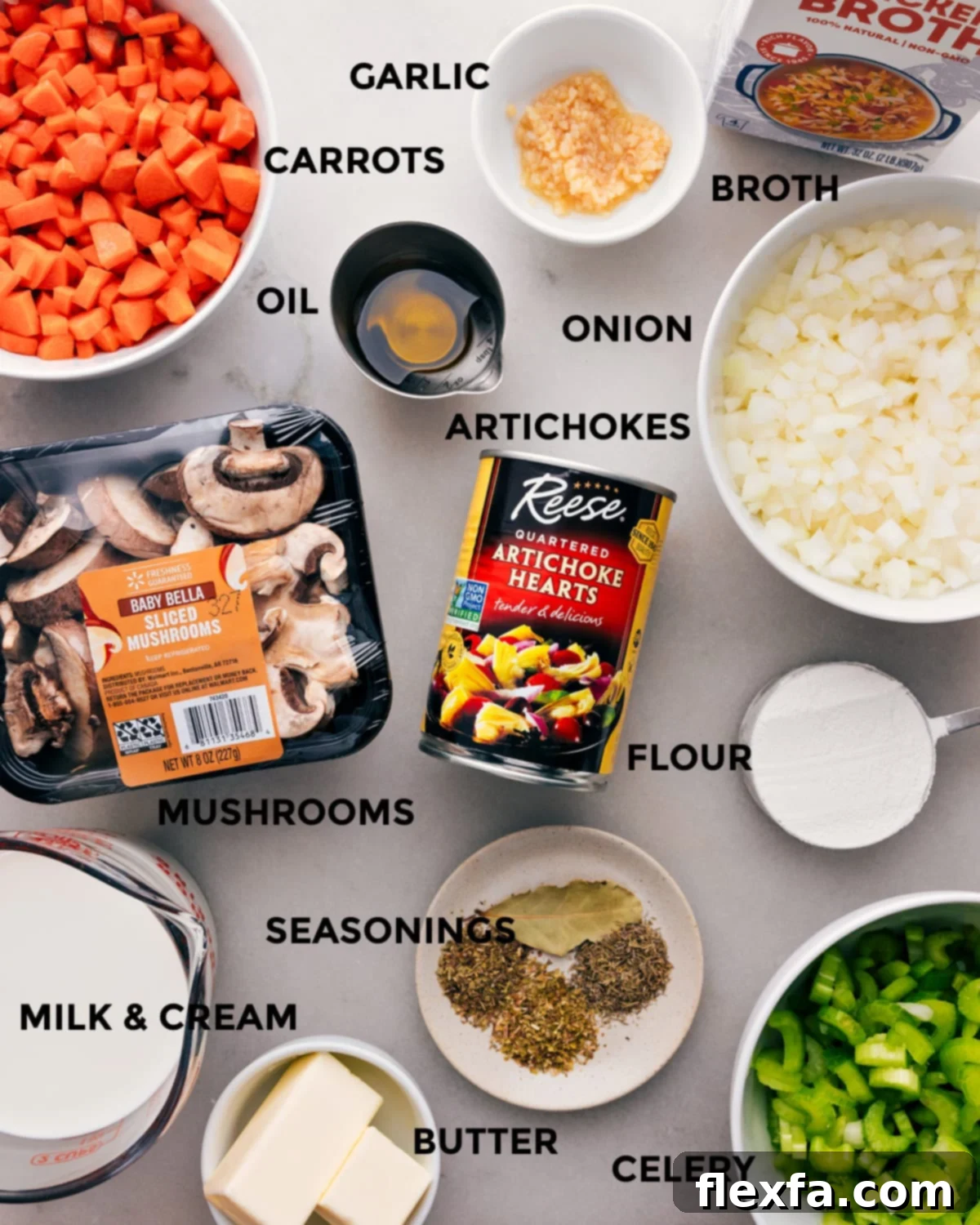 Fresh ingredients laid out for creamy artichoke soup, including whole mushrooms, butter sticks, a diced onion, milk, heavy cream, and canned artichoke hearts.