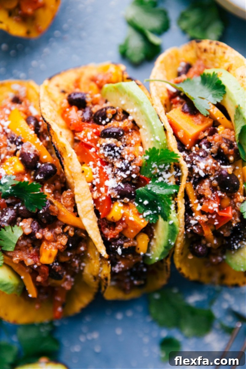 Up-close image of perfectly assembled Quinoa Fajitas, richly garnished with fresh toppings, showcasing vibrant colors and textures.