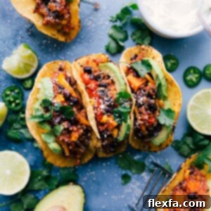 A plate of freshly prepared Quinoa Fajitas with vibrant ingredients and toppings.
