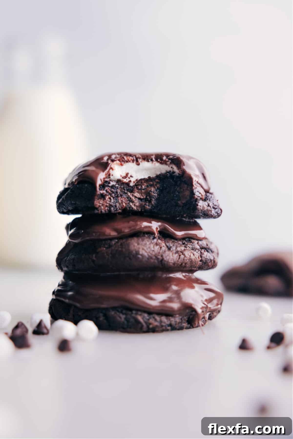 Irresistible Stacked Chocolate Marshmallow Cookies Stacked Chocolate Marshmallow Cookies with a rich, fudgy base, gooey marshmallow, and shiny chocolate topping.