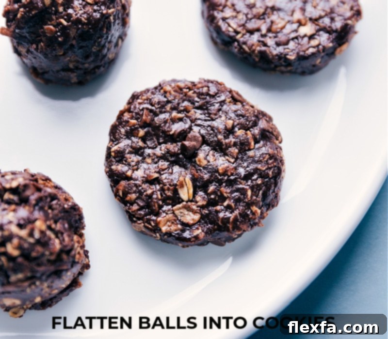 No-Bake Chocolate Peanut Butter Breakfast Cookies being flattened into perfect shapes.