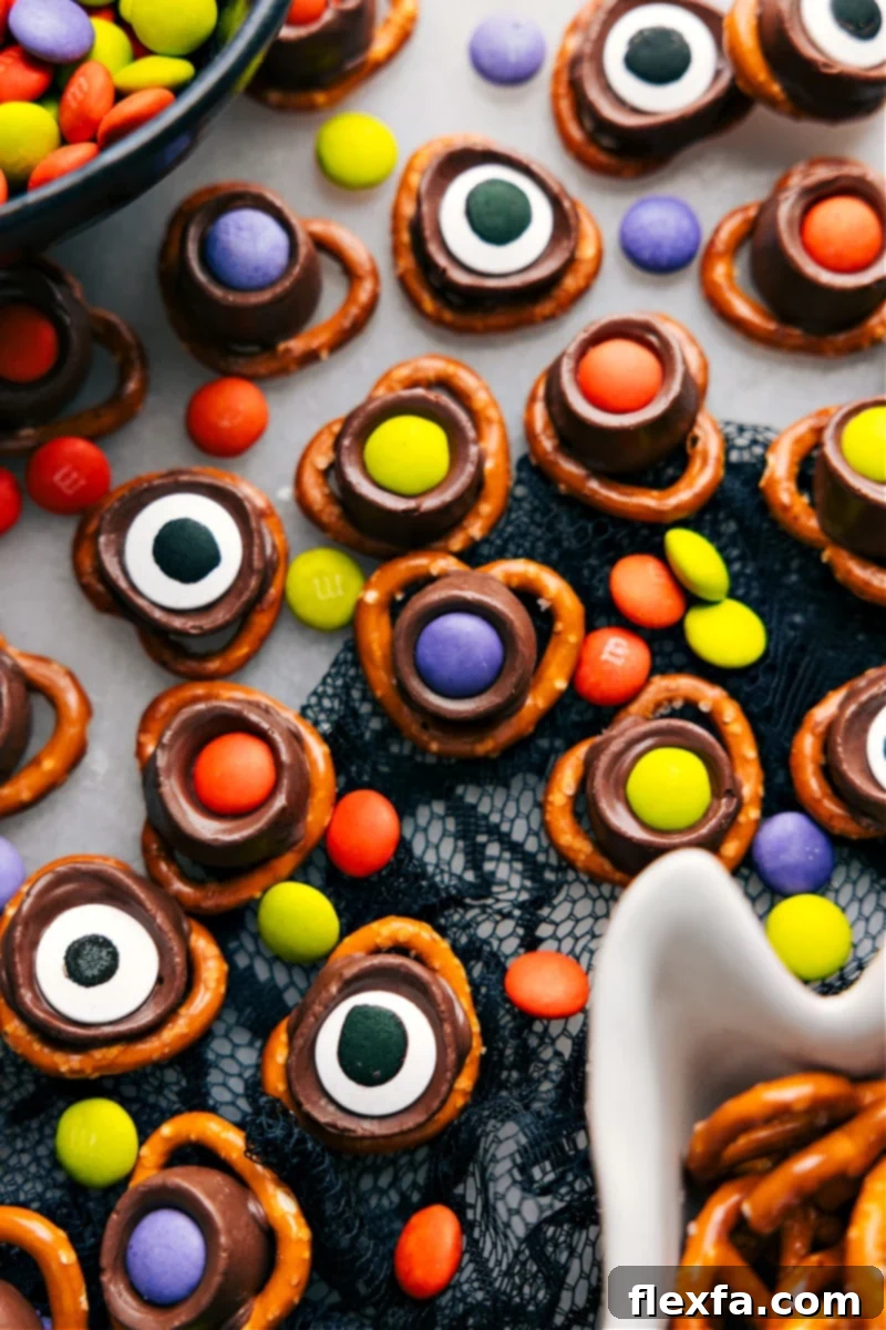 An overhead image of eerie Monster Eyeballs Halloween treats on a tray, complete with pretzel twists and candy eyes.
