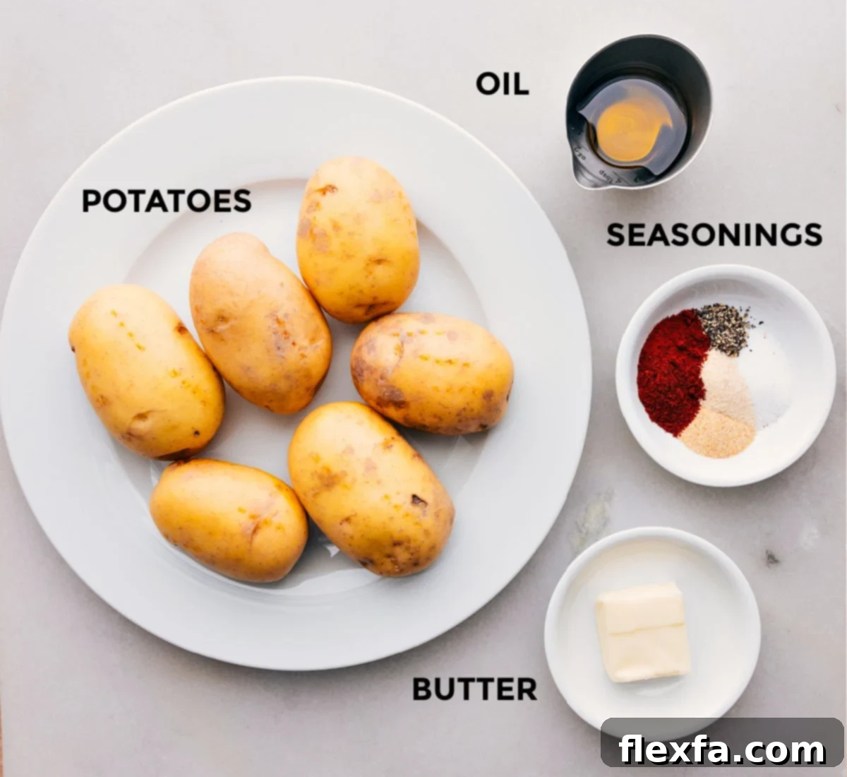 All the fresh ingredients for Skillet Breakfast Potatoes prepped and laid out on a cutting board.