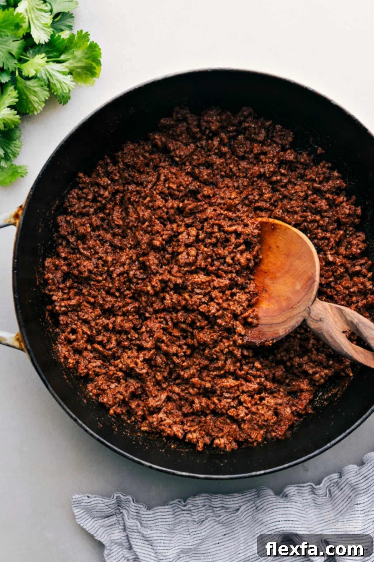 Taco Meat Recipe in the pan ready to be served, garnished with fresh cilantro.