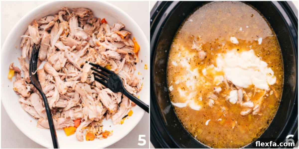 Shredded chicken being added back into the creamy wild rice soup within the slow cooker, ready for a final stir and serving.