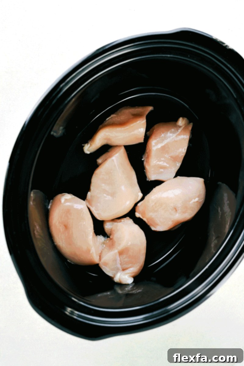 Close-up of the Crockpot Creamy Chicken and Wild Rice Casserole, highlighting the tender chicken, wild rice, and creamy sauce.