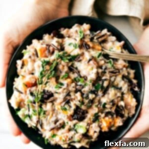 Finished Crockpot Cheesy Chicken and Wild Rice Casserole in a serving bowl.