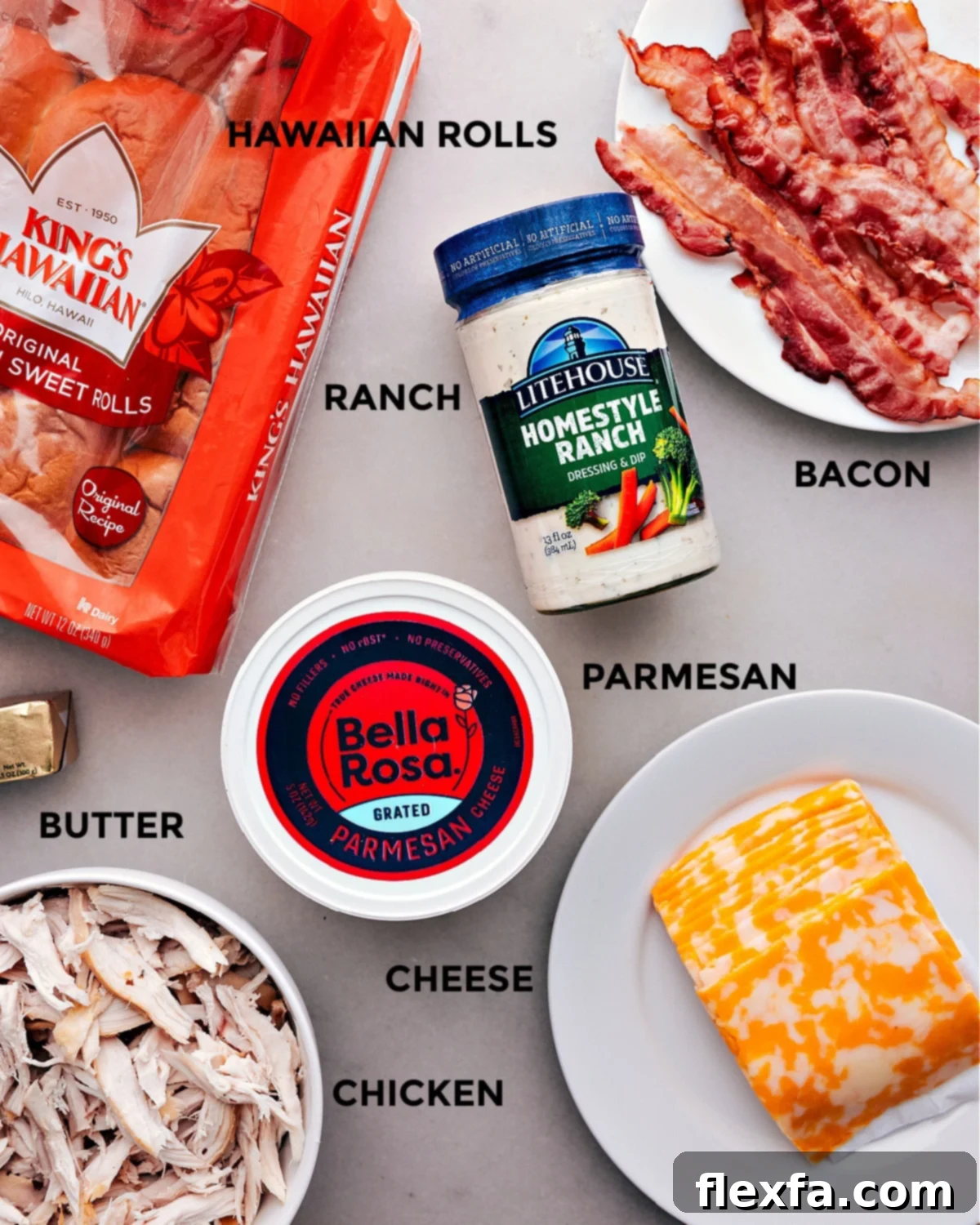 All the fresh ingredients for Chicken Bacon Ranch Sliders laid out neatly for easy preparation, including rolls, chicken, bacon, cheese, and ranch.