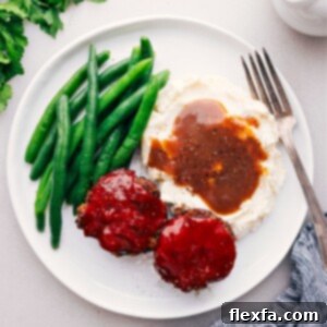 Perfectly Portioned Meatloaf Minis 2 Mini Meatloaf Recipe on a plate with potatoes and green beans.