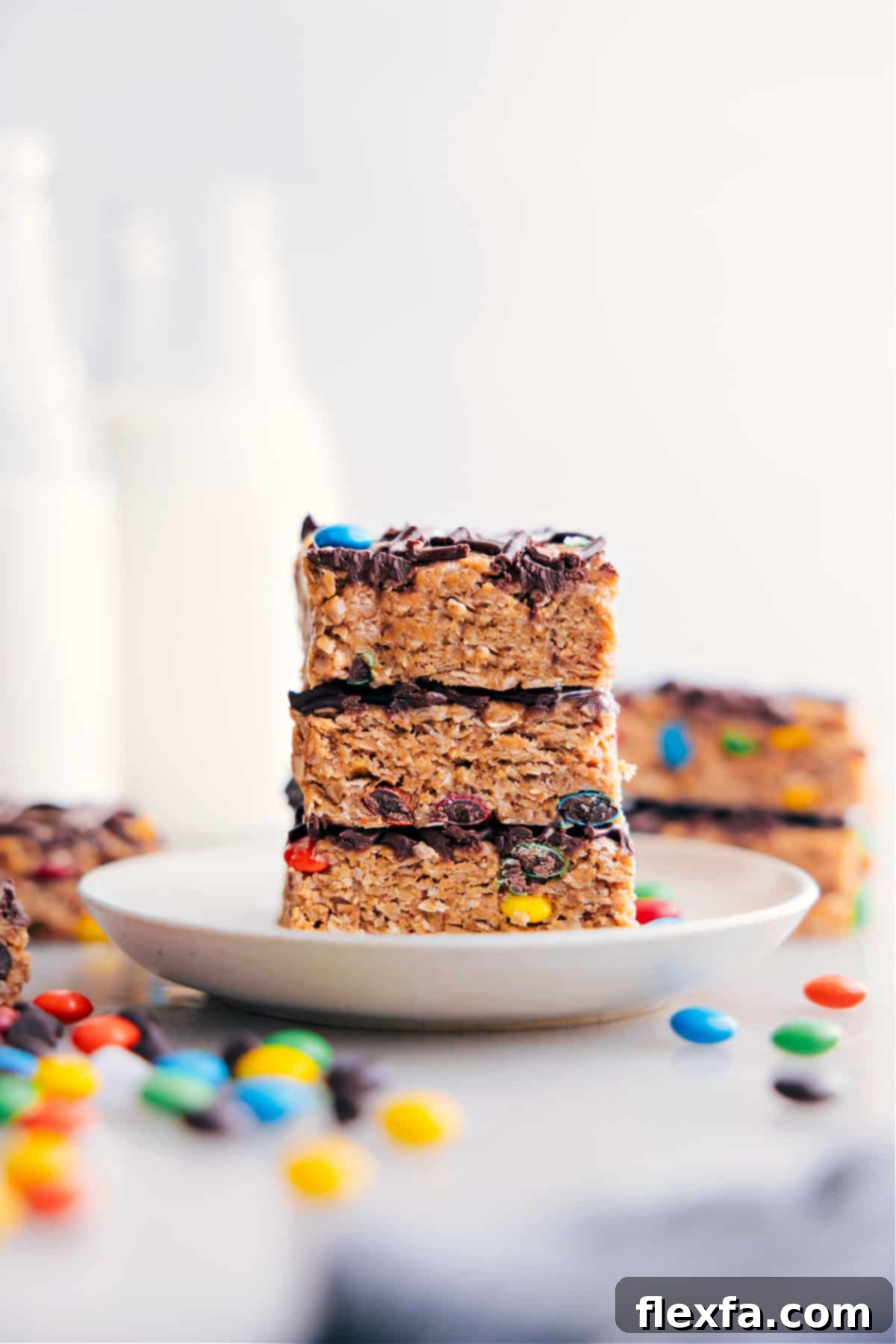 Homemade Energy Bars, perfectly cut into neat squares and stacked on a plate.