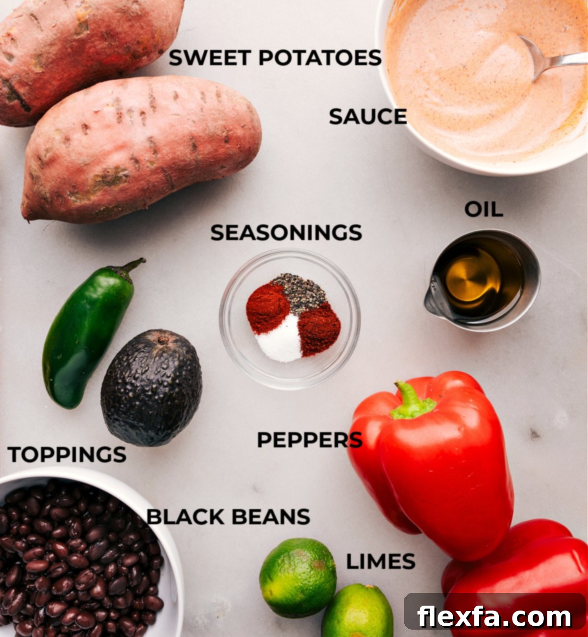 Prepped ingredients for flavorful Sweet Potato and Black Bean Burrito Bowls Ingredients for Sweet Potato and Black Bean Burrito Bowls including diced sweet potatoes, canned black beans, sliced peppers, halved avocado, and sliced jalapenos, halved limes, and a bowl of dressing.