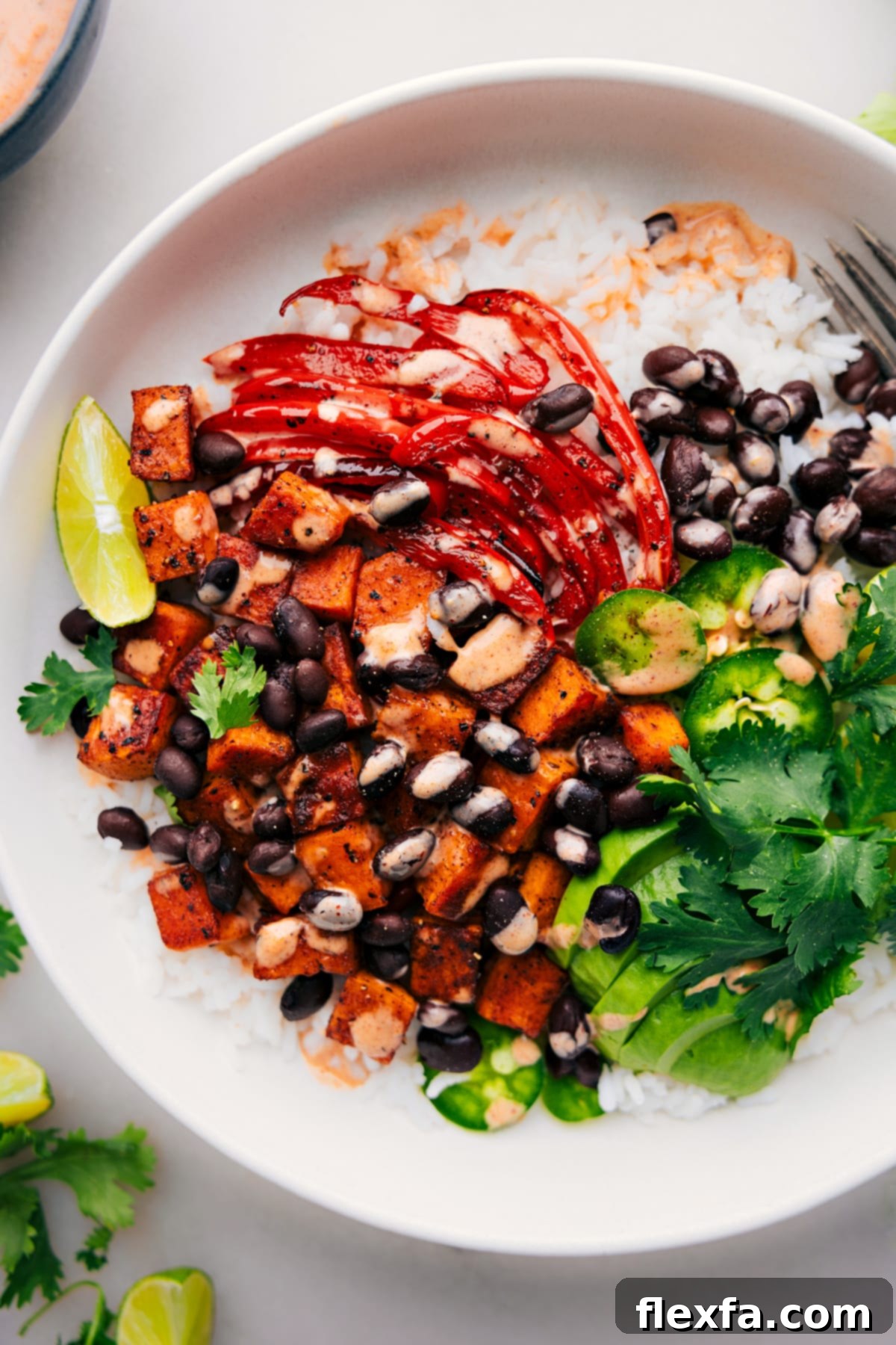 Ready-to-savor Sweet Potato and Black Bean Burrito Bowls Sweet Potato and Black Bean Burrito Bowls, colorfully assembled and ready to be enjoyed.