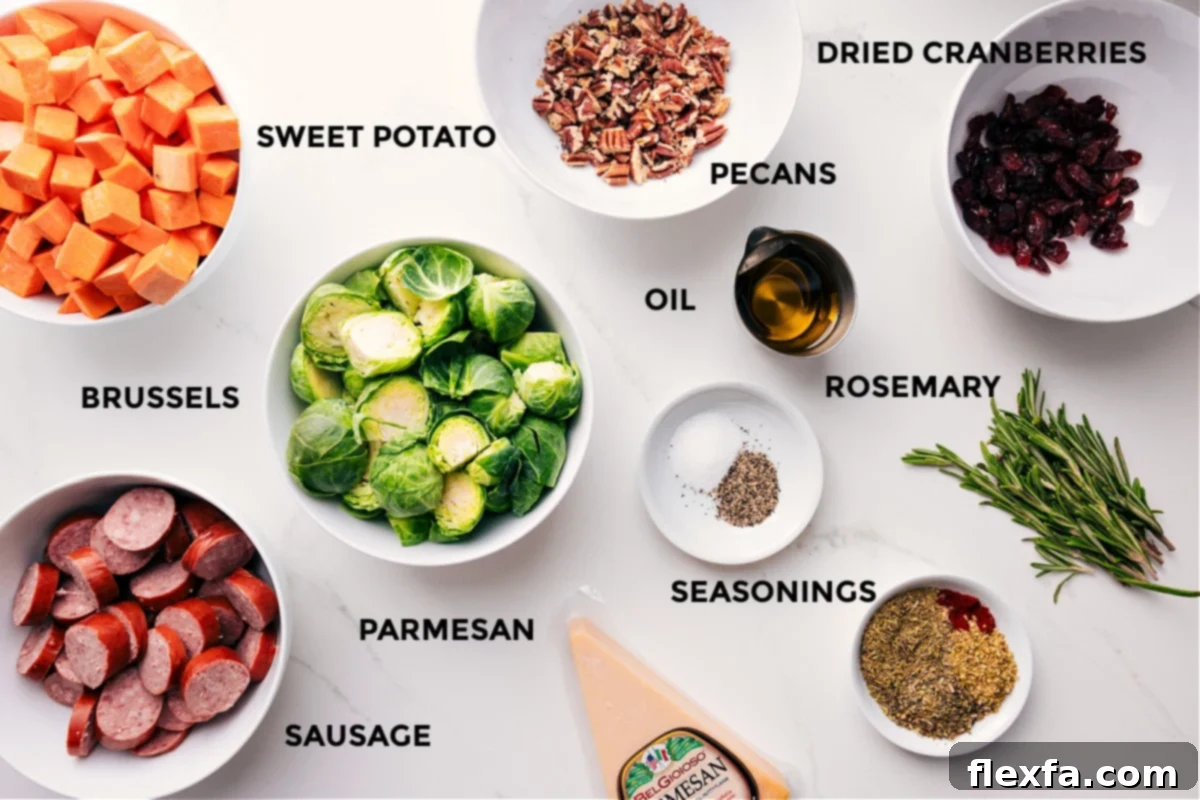 A beautifully arranged selection of fresh ingredients: vibrant orange sweet potatoes, plump sausages, green Brussels sprouts, aromatic rosemary sprigs, sweet dried cranberries, crunchy pecans, and a block of Parmesan cheese, all meticulously prepped and ready for a sheet pan.